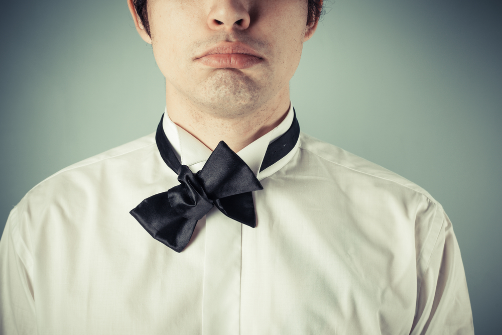 Sad groom with bow tie