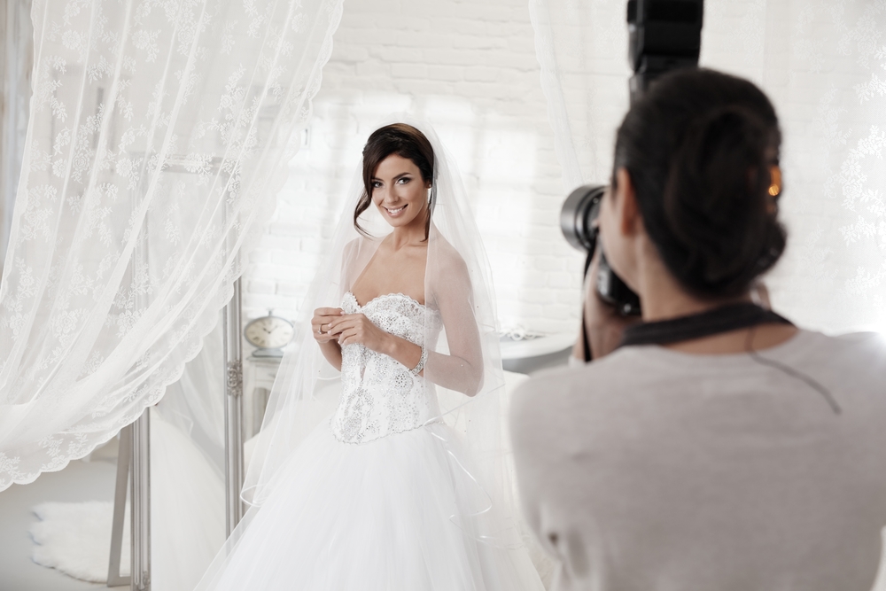 Beautiful bride posing front of photographer