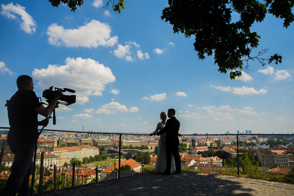 Wedding photographer filming the bride and groom