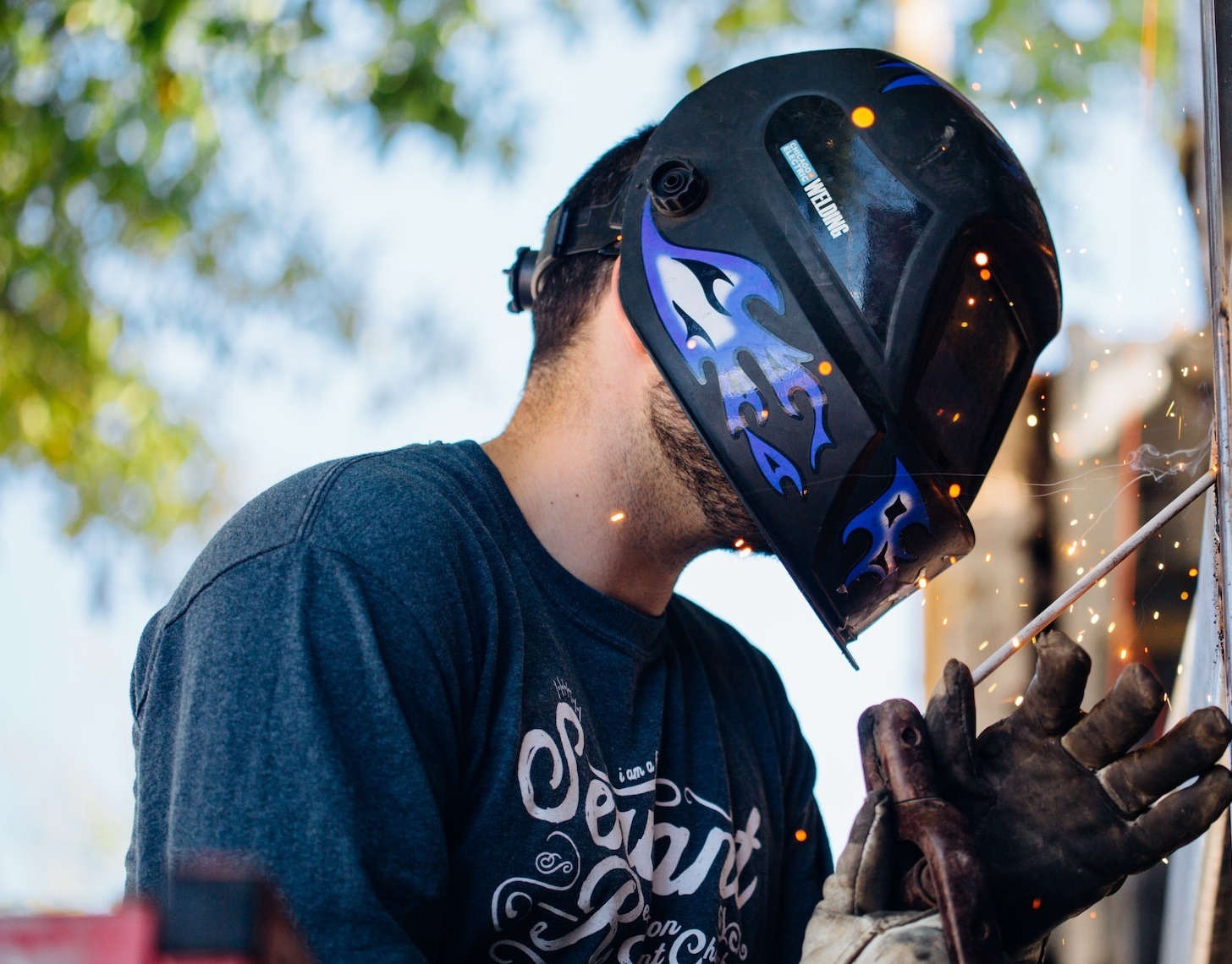 Man welding outside.