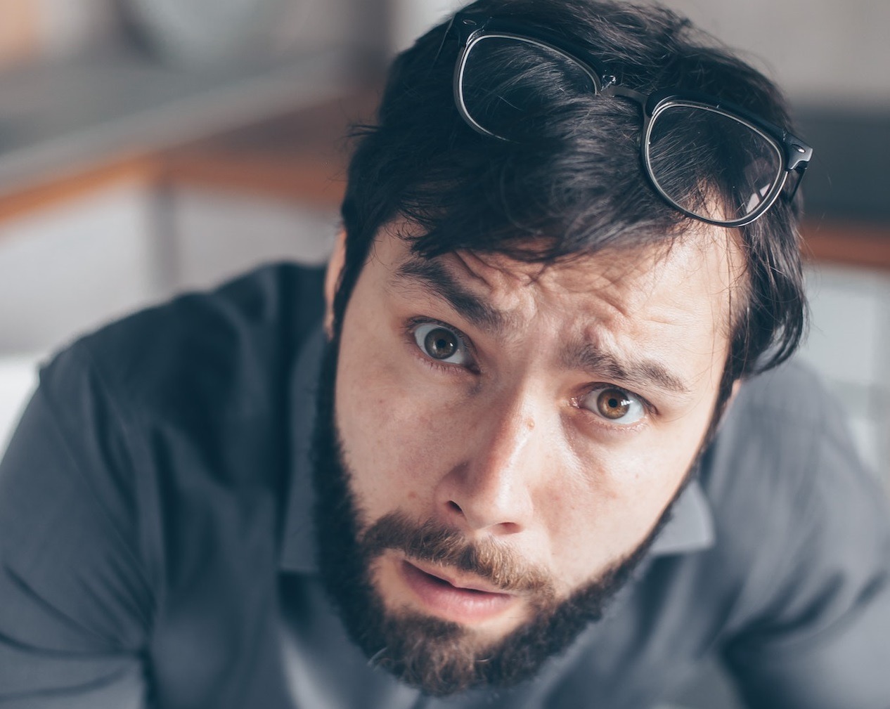 Bearded man feeling confused.