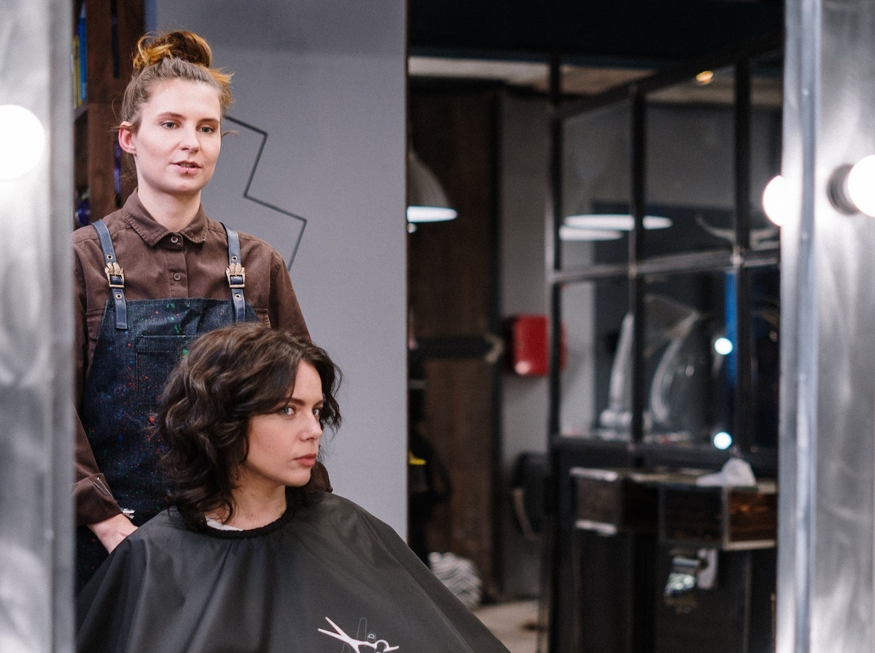 Woman at hair stylist.