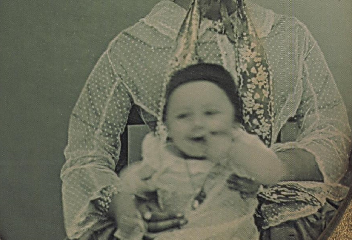 Photo of Unindentified woman and baby in her lap, - 1855.