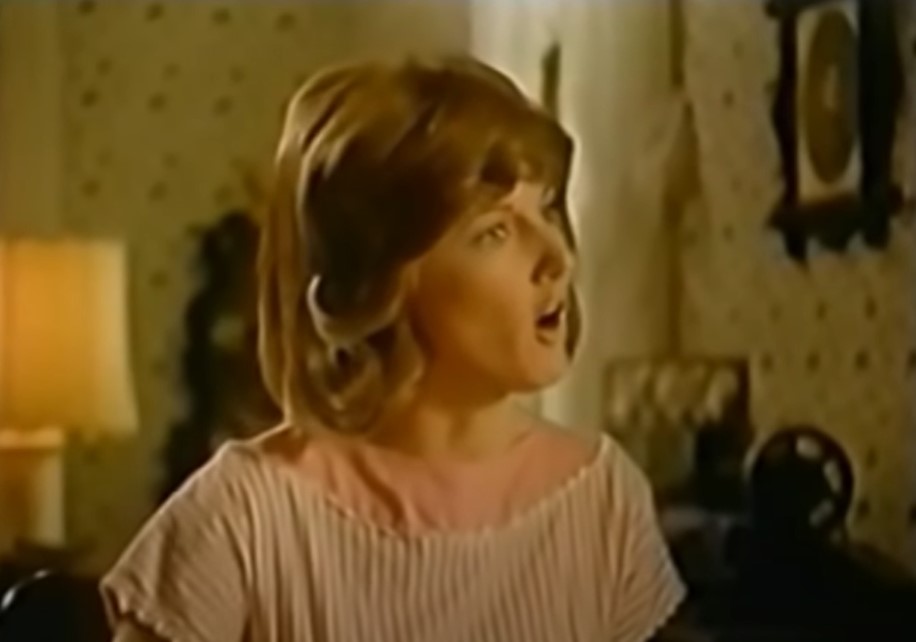 Annette O'Toole as Tammy Wynette in Stand by Your Man in pink top