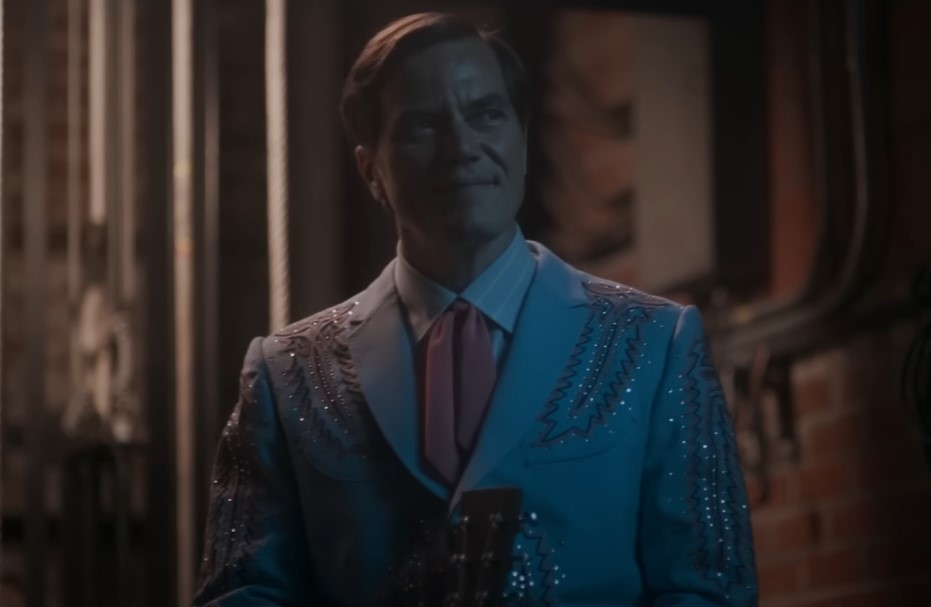 Michael Shannon as George Jones at stage getting ready to sing in a blue suit