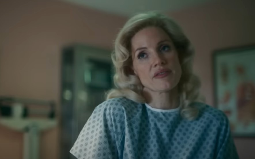 Jessica Chastain as Tammy Wynette in hospital robe
