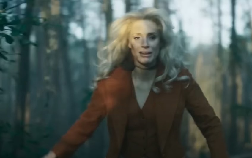 Jessica Chastain as Tammy Wynette running in forest