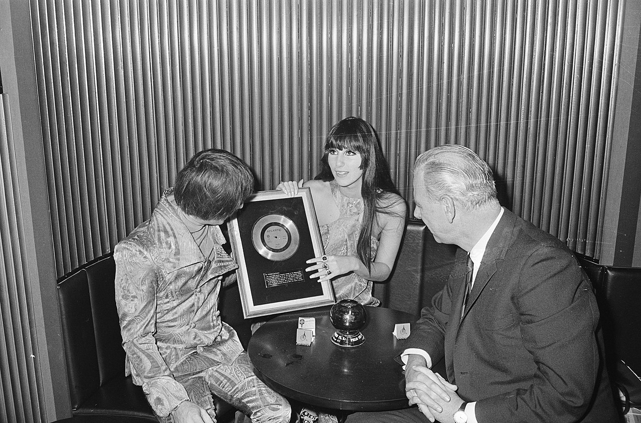 Sonny and  Cher holding an award