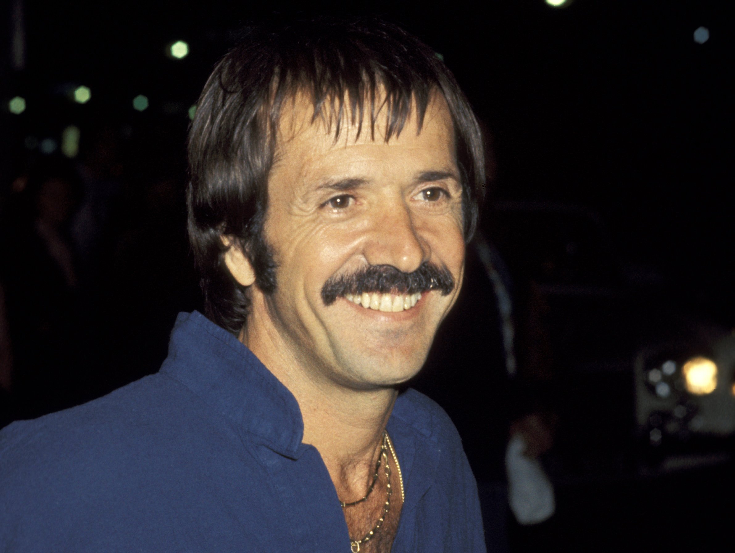 Sonny Bono and Family  at Palm Restaurant in Beverly Hills June 10, 1977, wearing blue shirt