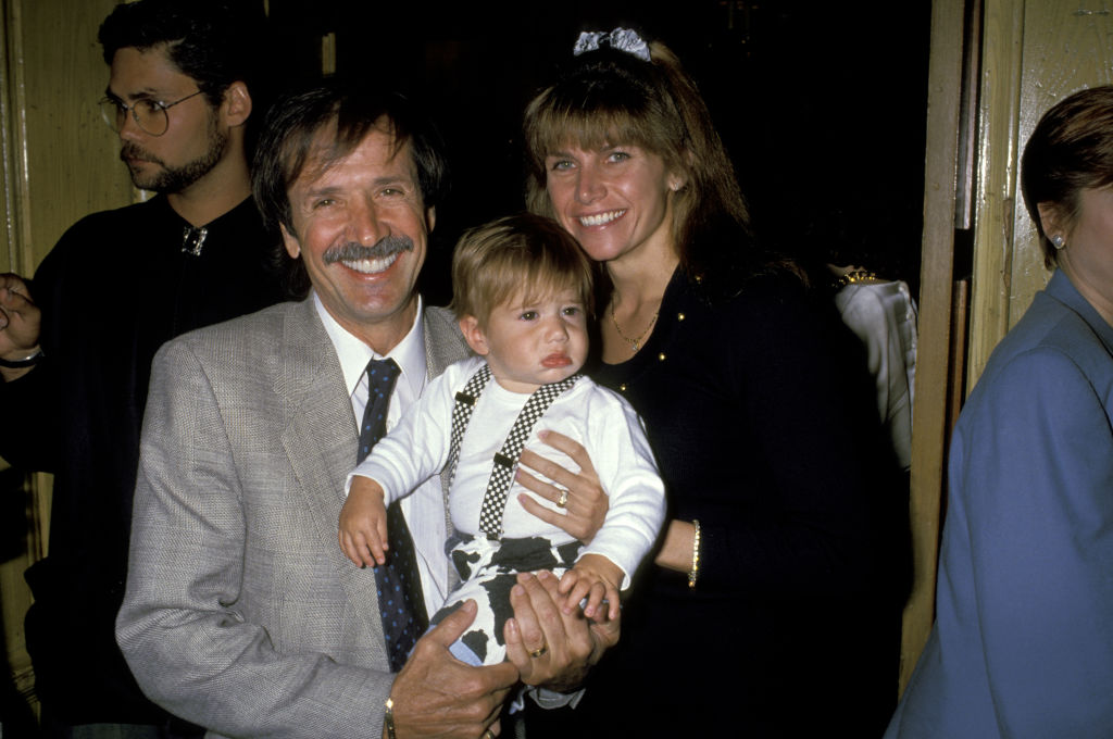 Sonny Bono, wife Mary Bono and son Chesare Elan looking at the camera smiling
