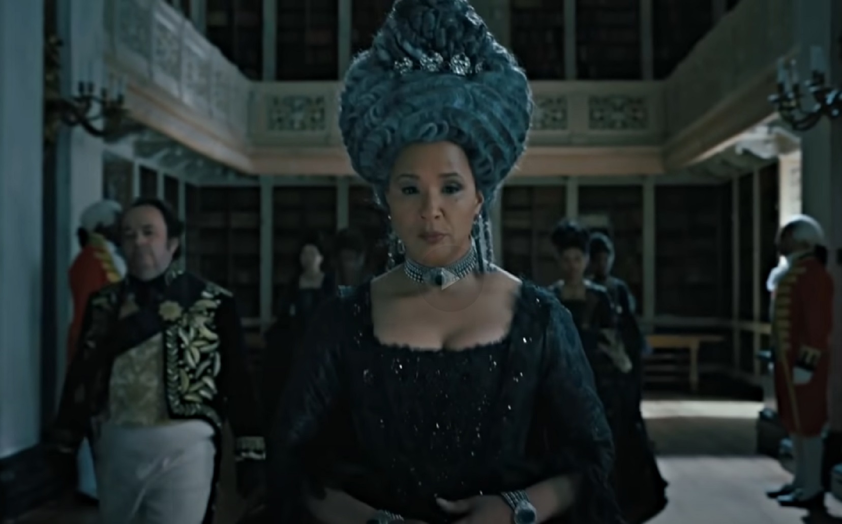 Screenshot : Queen Charlotte (Golda Rosheuvel) wearing black dress walking at camera - from Queen Charlotte: A Bridgerton Story (2023)