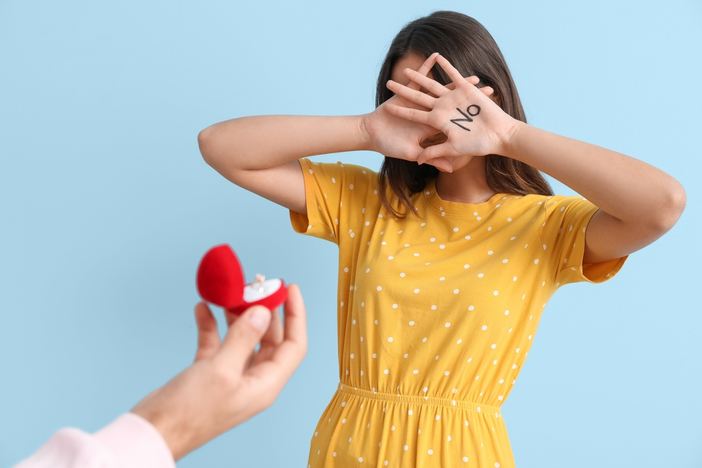 Young woman rejecting marriage proposal