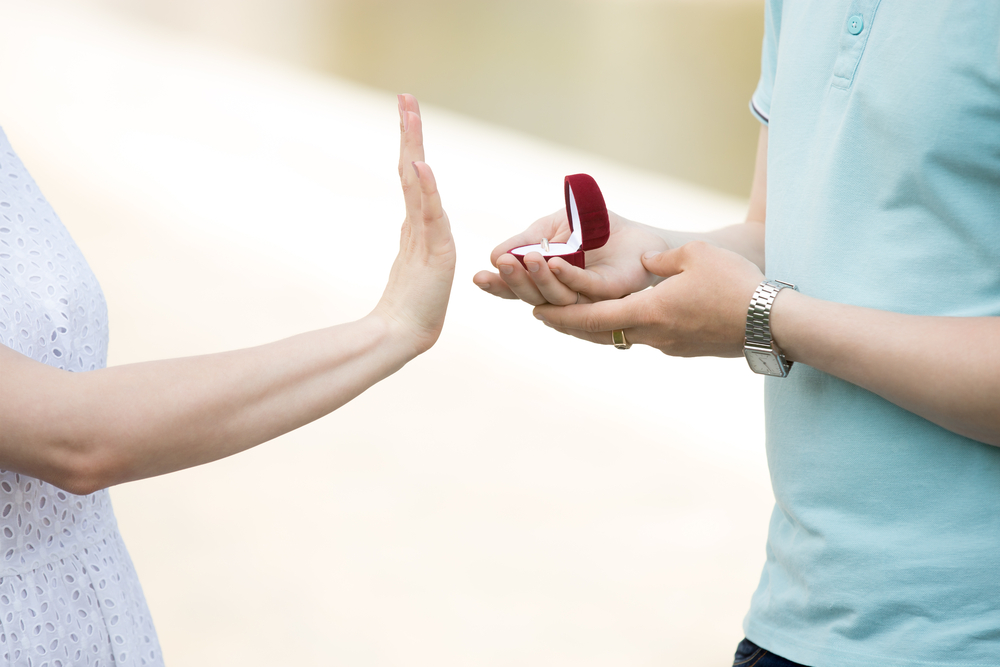woman turning down engagement proposal
