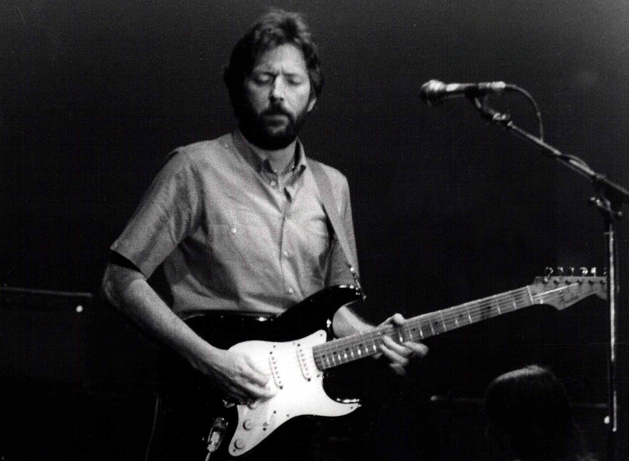 B&W photo of Eric Clapton playing the guitar - 2009