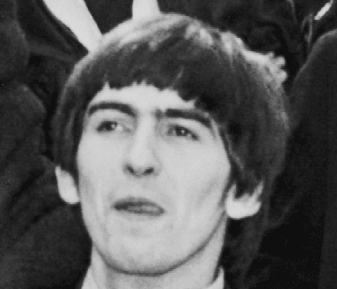 Photograph of George Harrison as the Beatles arrive in New York City