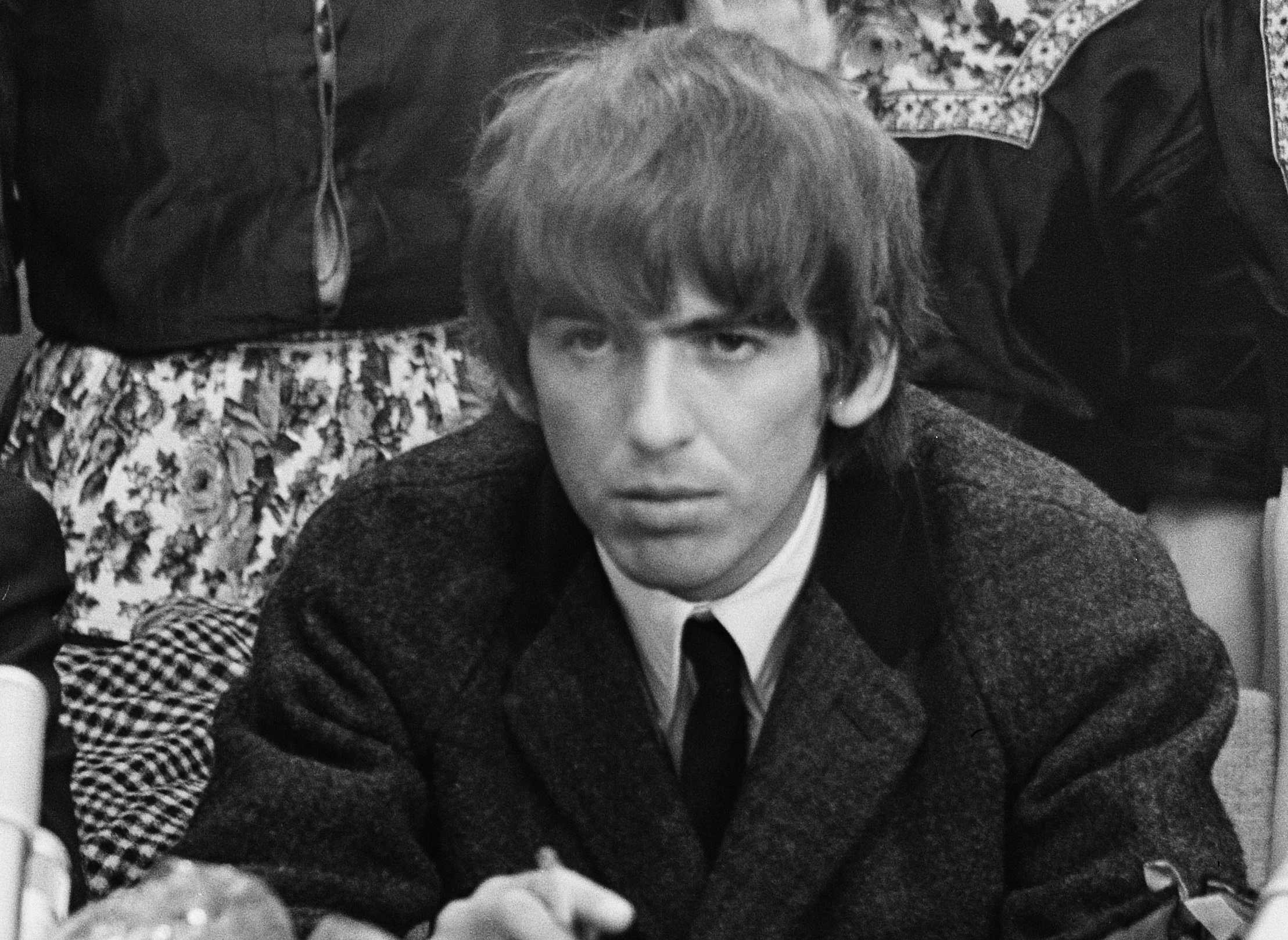 B&W photo of George Harrison  looking at front - 1964