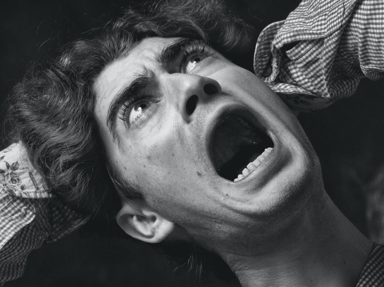 Portrait of screaming man with open mouth.