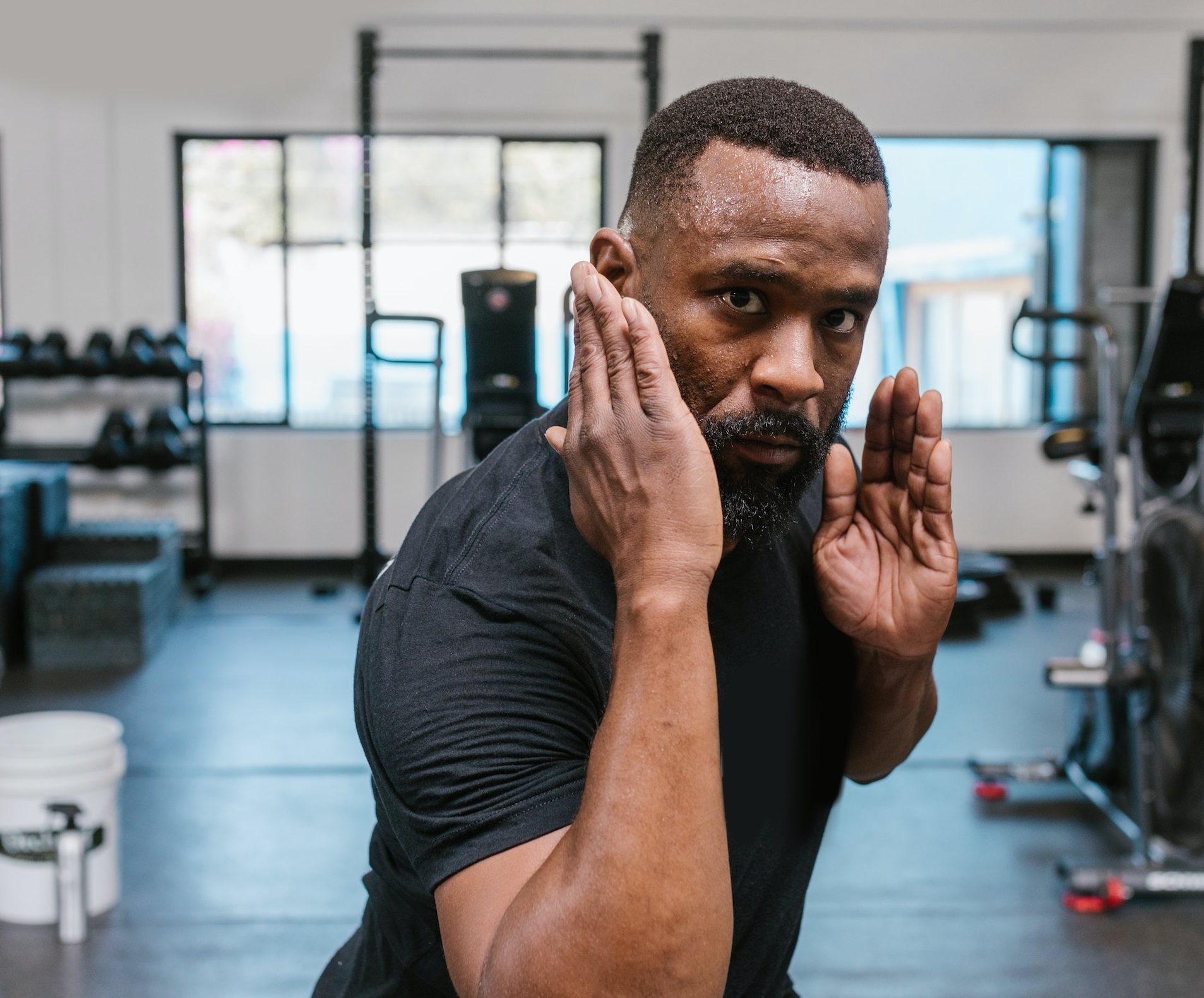 Black man is exercise karate in the gym.