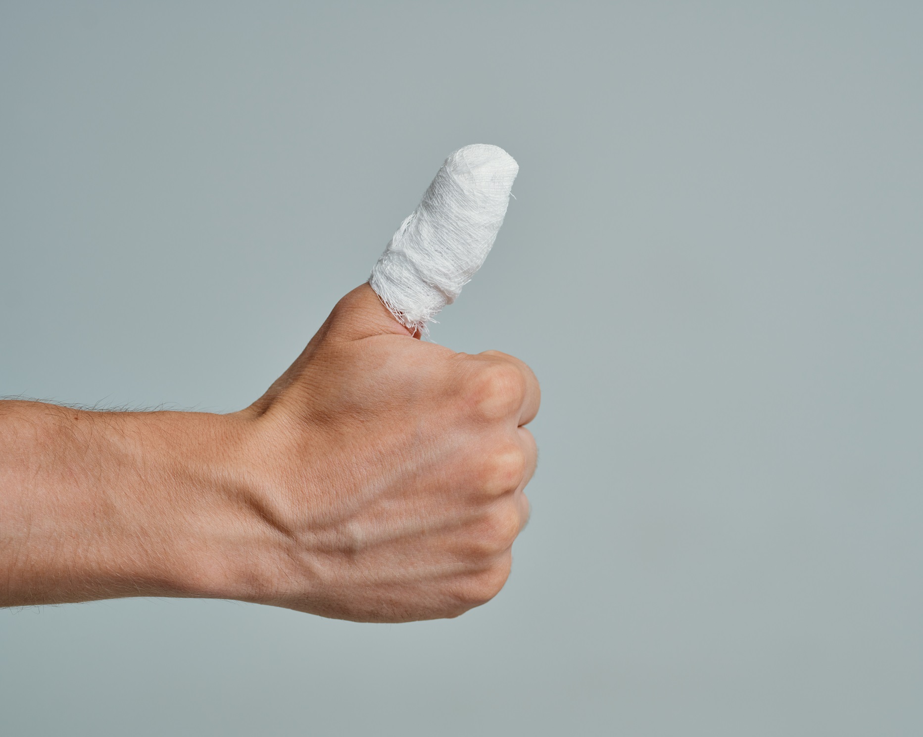 Gray background banded thumb, thumb positive gesture.