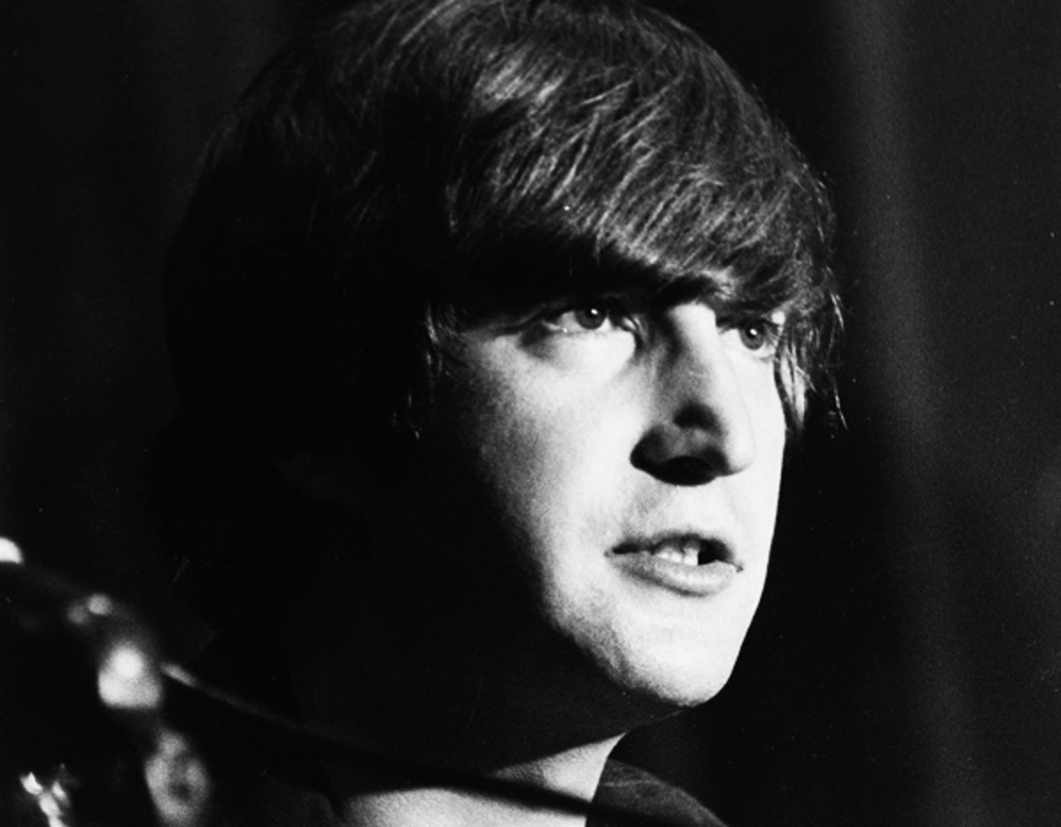 Close Up B&W photo of John Lennon looking at side - 1964