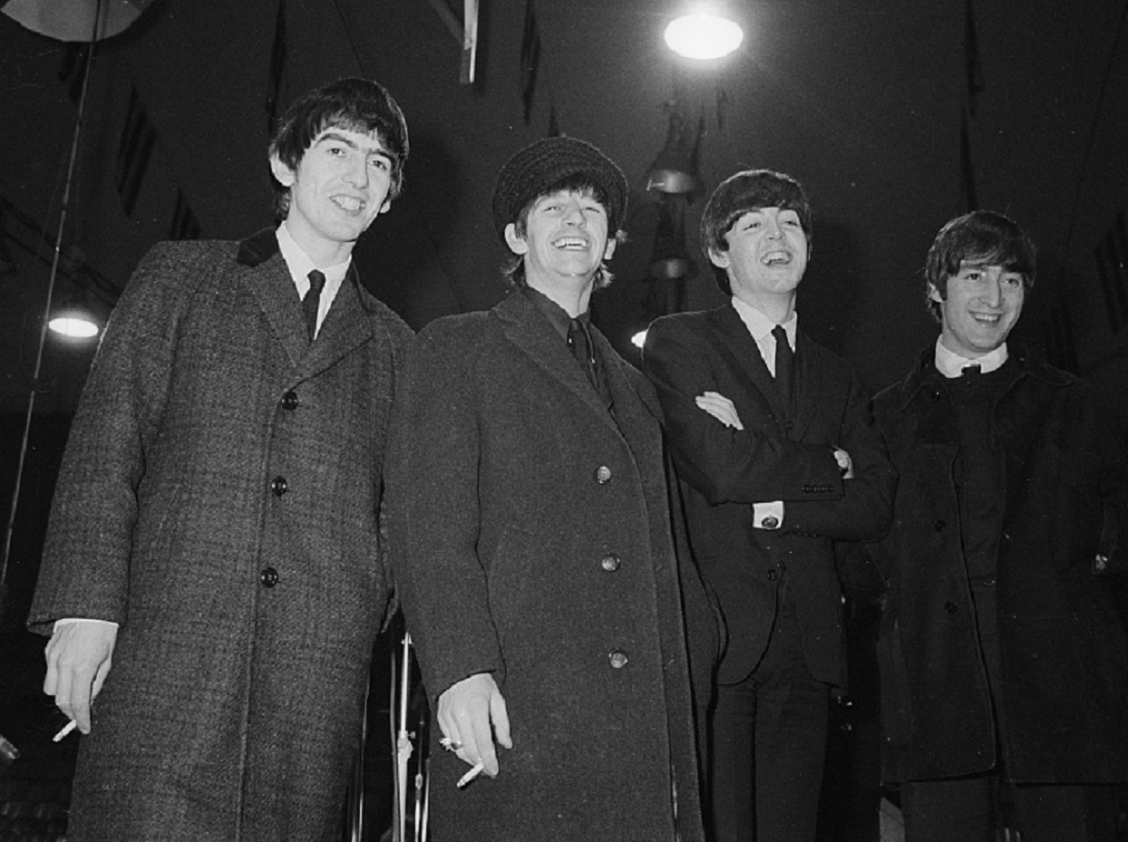 B&W photo of The Beatles at press conference - 1964