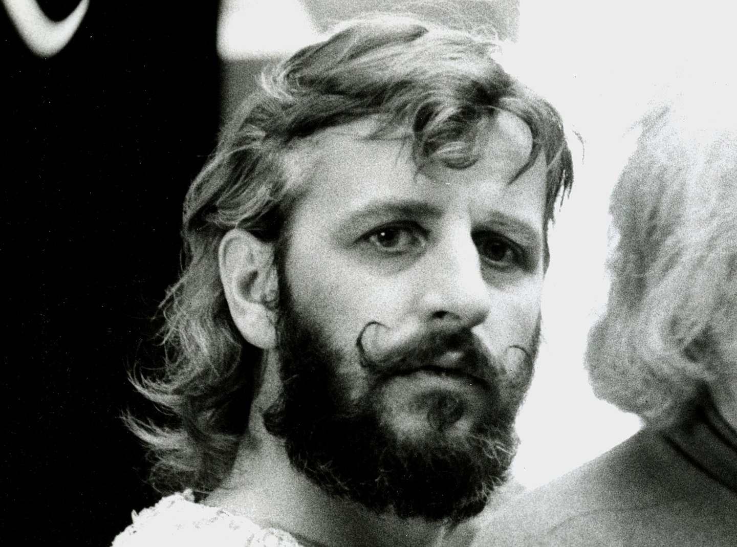 B&W photo of Ringo Starr with beard looking at side - 1974