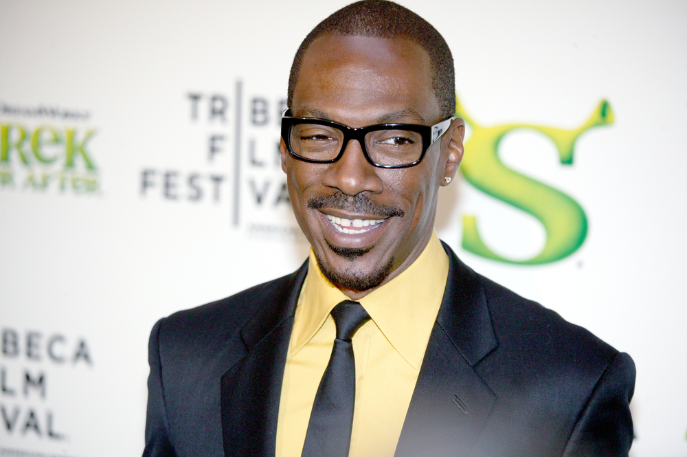 Actor Eddie Murphy at Tribeca Shrek Forever After premier at Ziegfeld Theater on April 21, 2010 in New York City in black suit and green