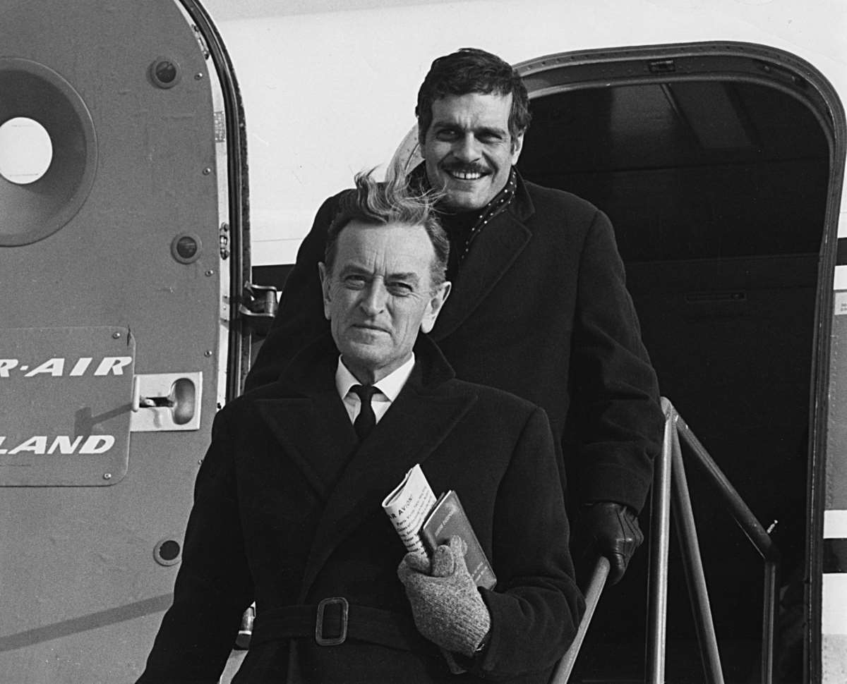 Photograph of the film director David Lean and actor Omar Sharif arriving to Joensuu, Finland
