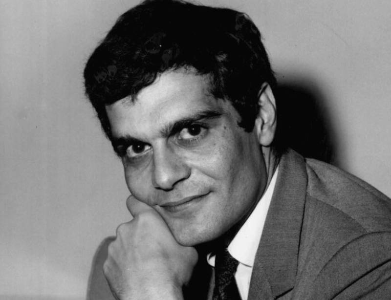 Photo of actor Omar Sharif in 1963 in gray suit