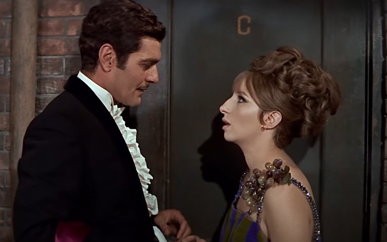 Barbra Streisand and Omar Sharif in Funny Girl looking at each other