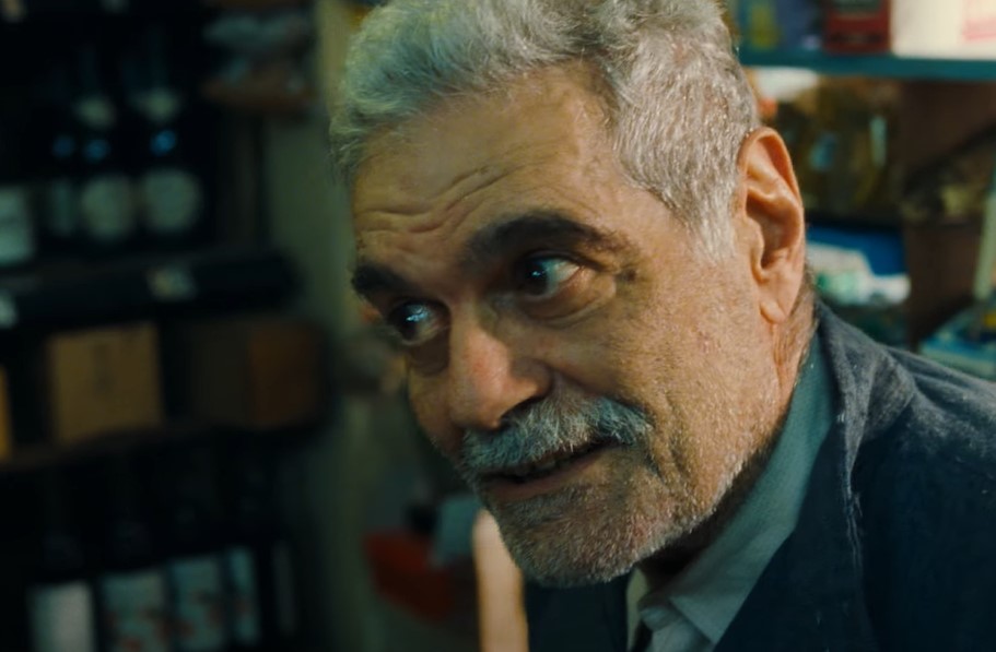 Omar Sharif in Monsieur Ibrahim in suit looking left