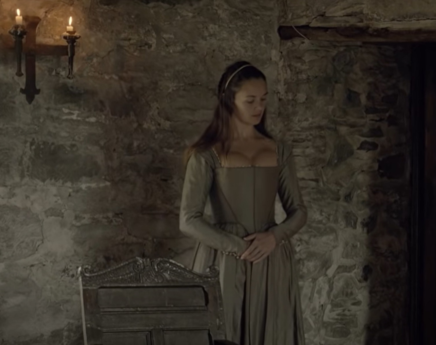 Screenshot : Upset woman inside a room ,looking down  - from The Stuarts: A Bloody Reign (2018)