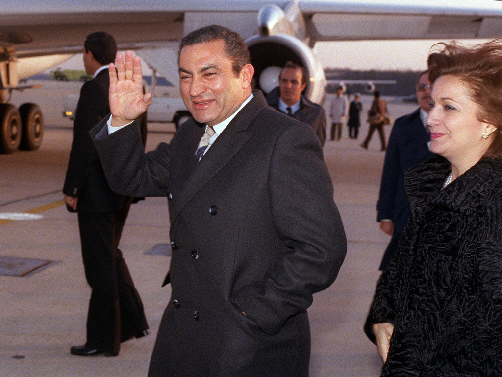 Egyptian President Hosni Mubarak waves to spectators
