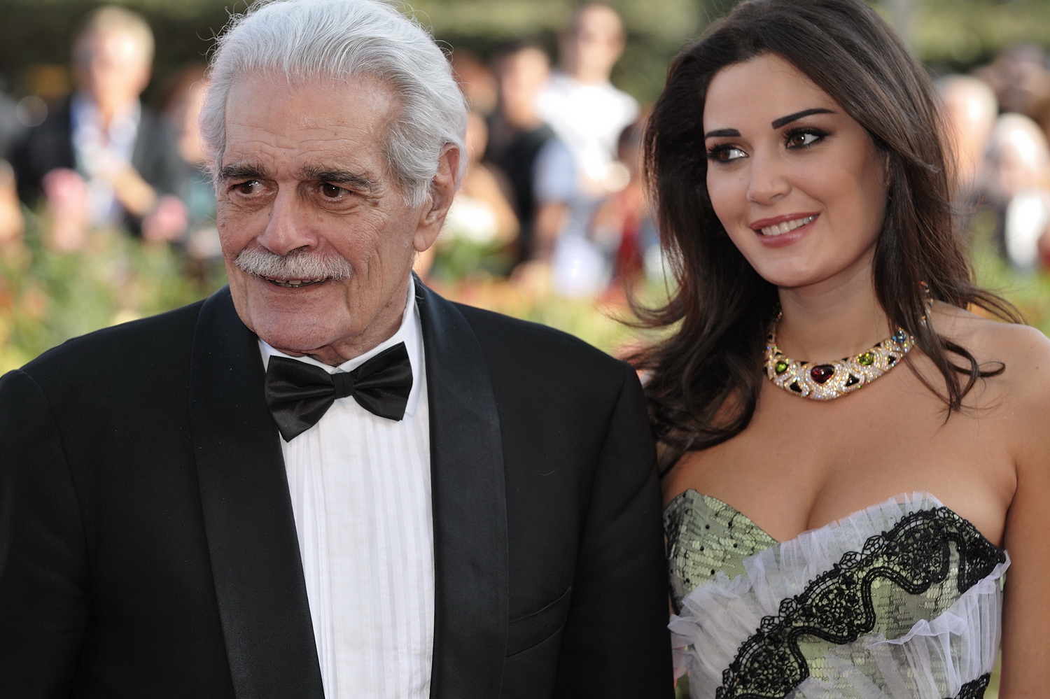 Omar Sharif and Cyrine AbdelNour at Venice Film Festival in formal clothes