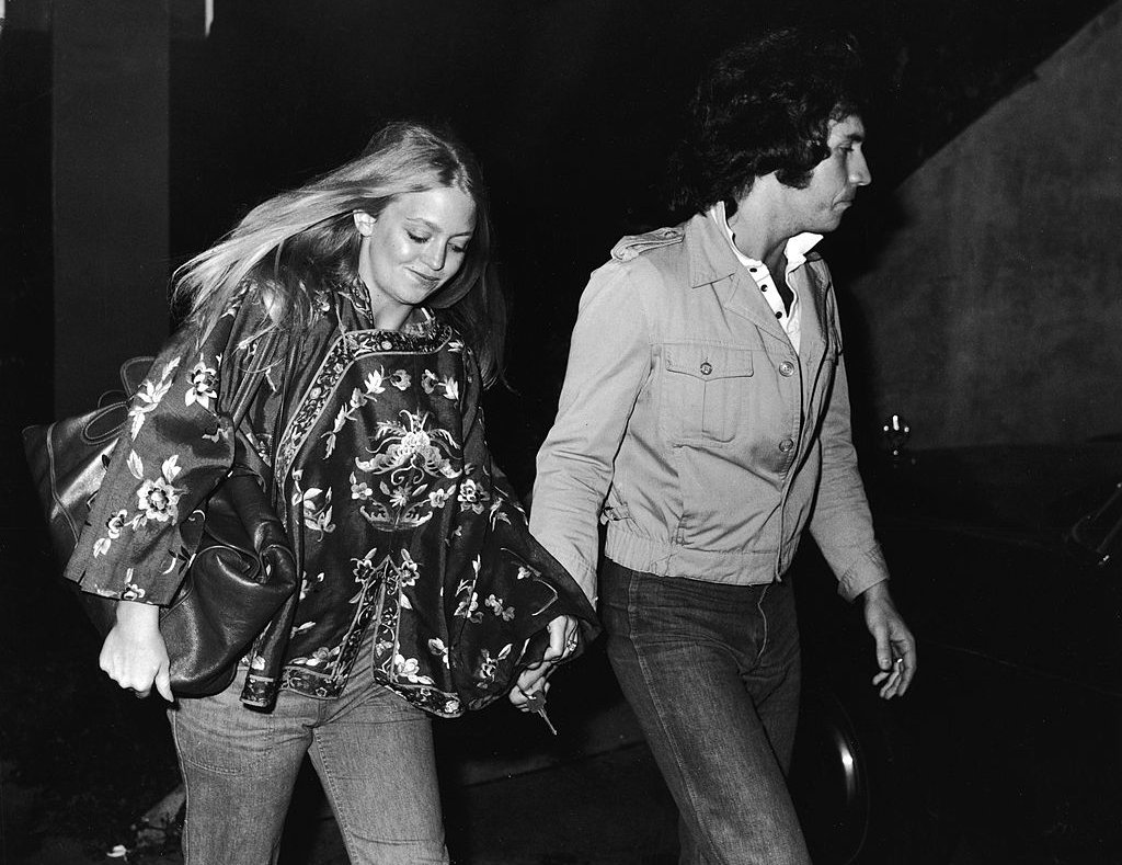 American actress Goldie Hawn and her second husband musician and television variety show host Bill Hudson arrive at the premiere of 'Taxi Driver,' February 8, 1976.