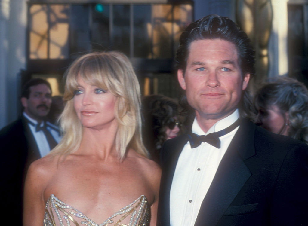 Goldie Hawn and Kurt Russell  1989 Academy Awards in black tuxedo and golden dress