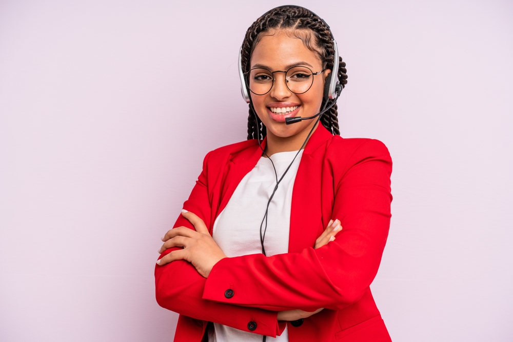 Woman at customer service in red blazer and headphones