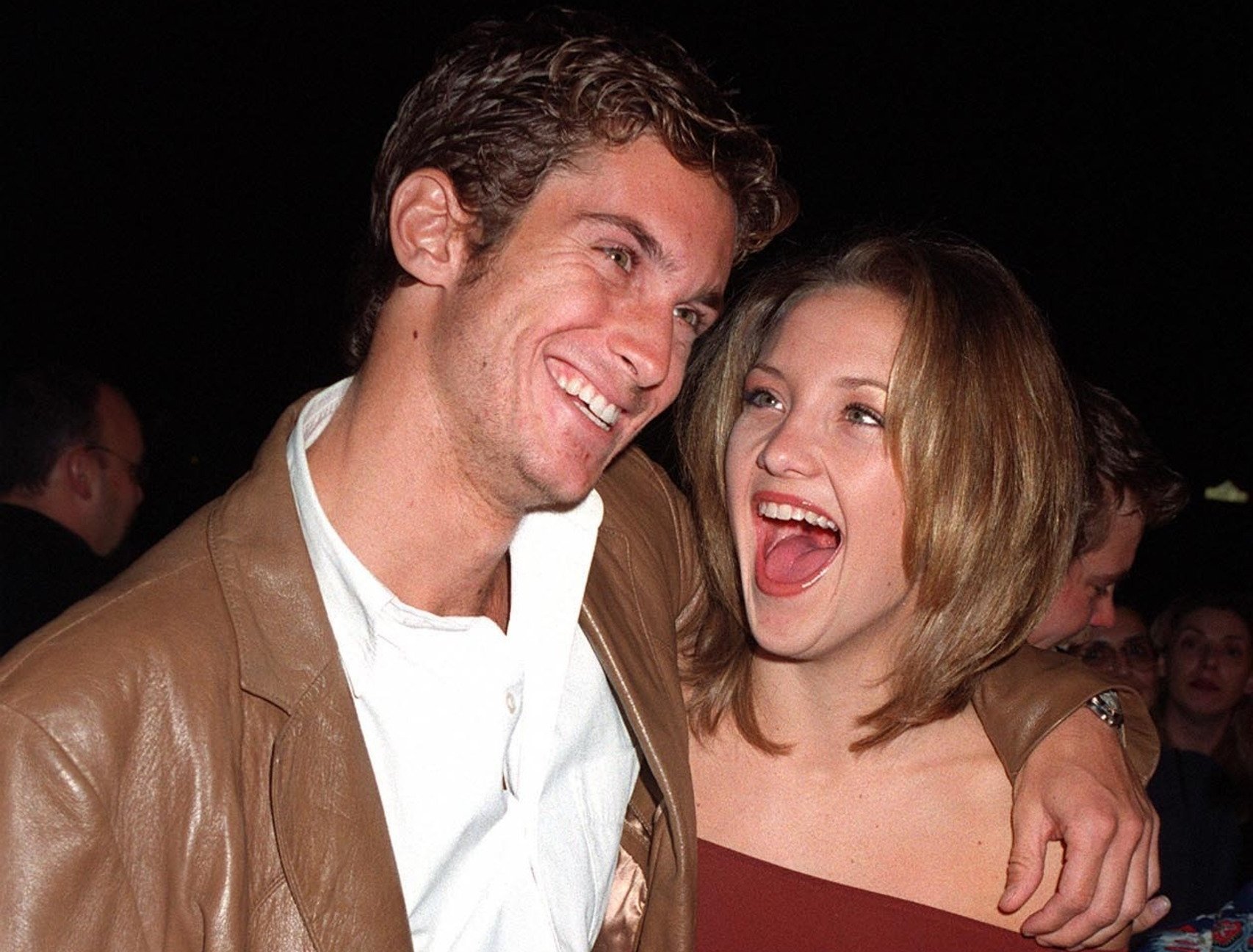 OLIVER & KATIE (KATE) HUDSON at premiere hugging and laughing looking at each other
