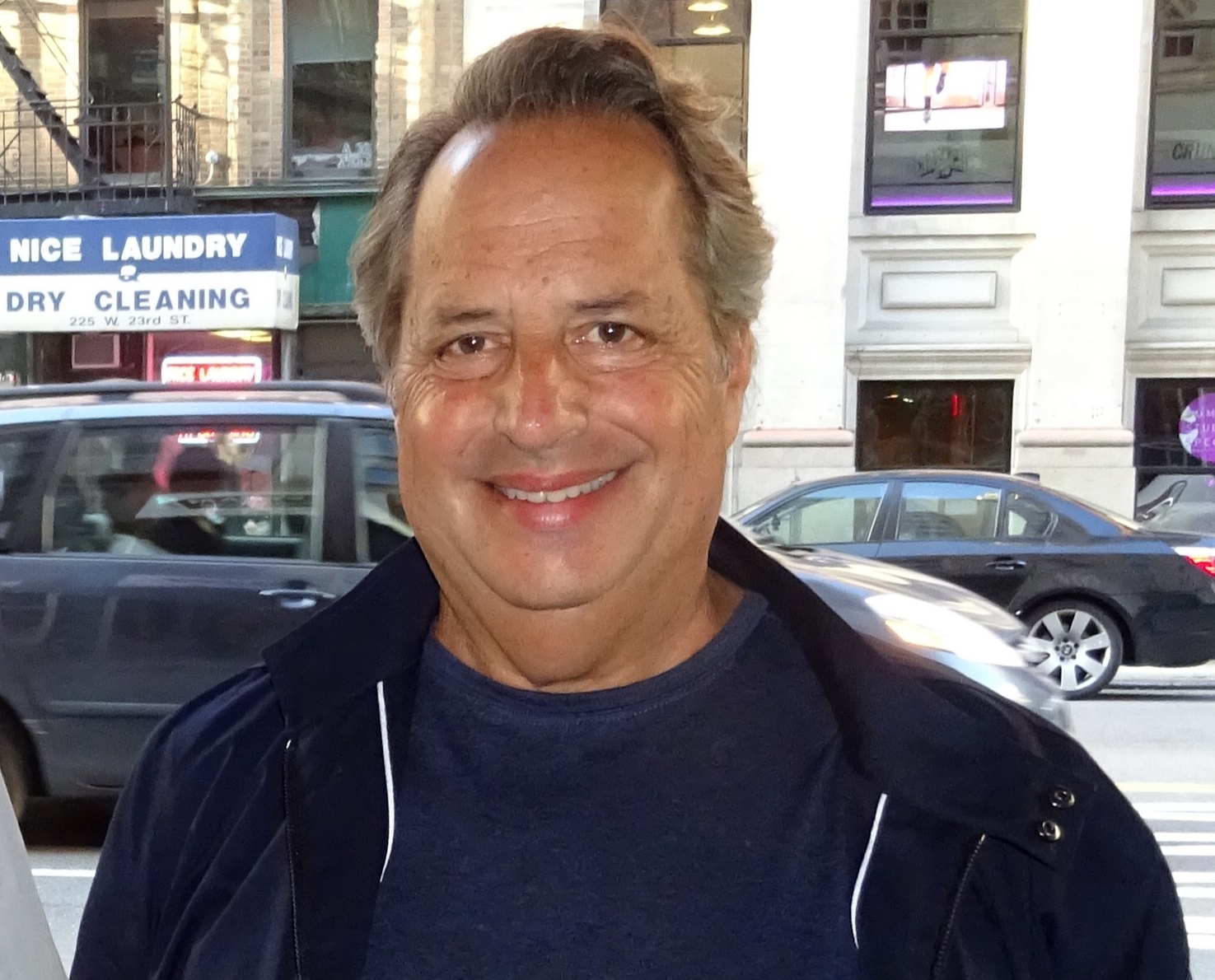 Jon Lovitz is smiling to the camera on the street - 2016