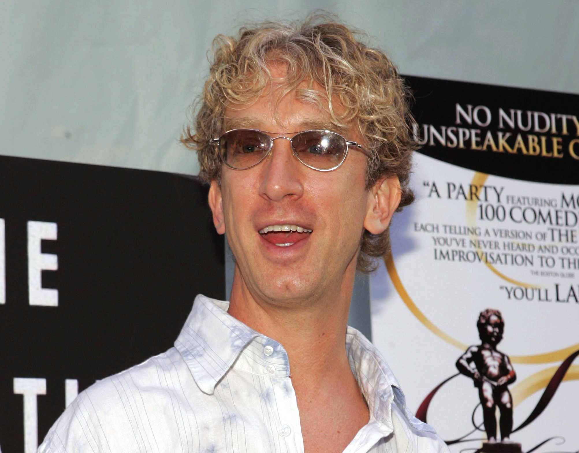 Andy Dick wearing white shirt and sunglasses is looking at side and smiling - 2005
