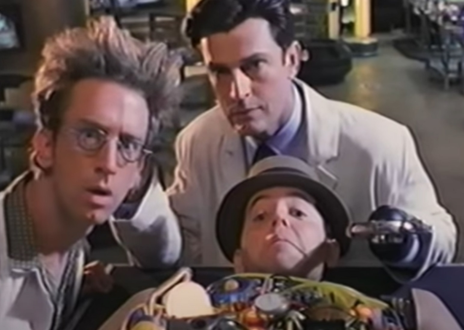 Screenshot: Andy Dick with messy hair is looking at camera  - from Inspector Gadget (2009)