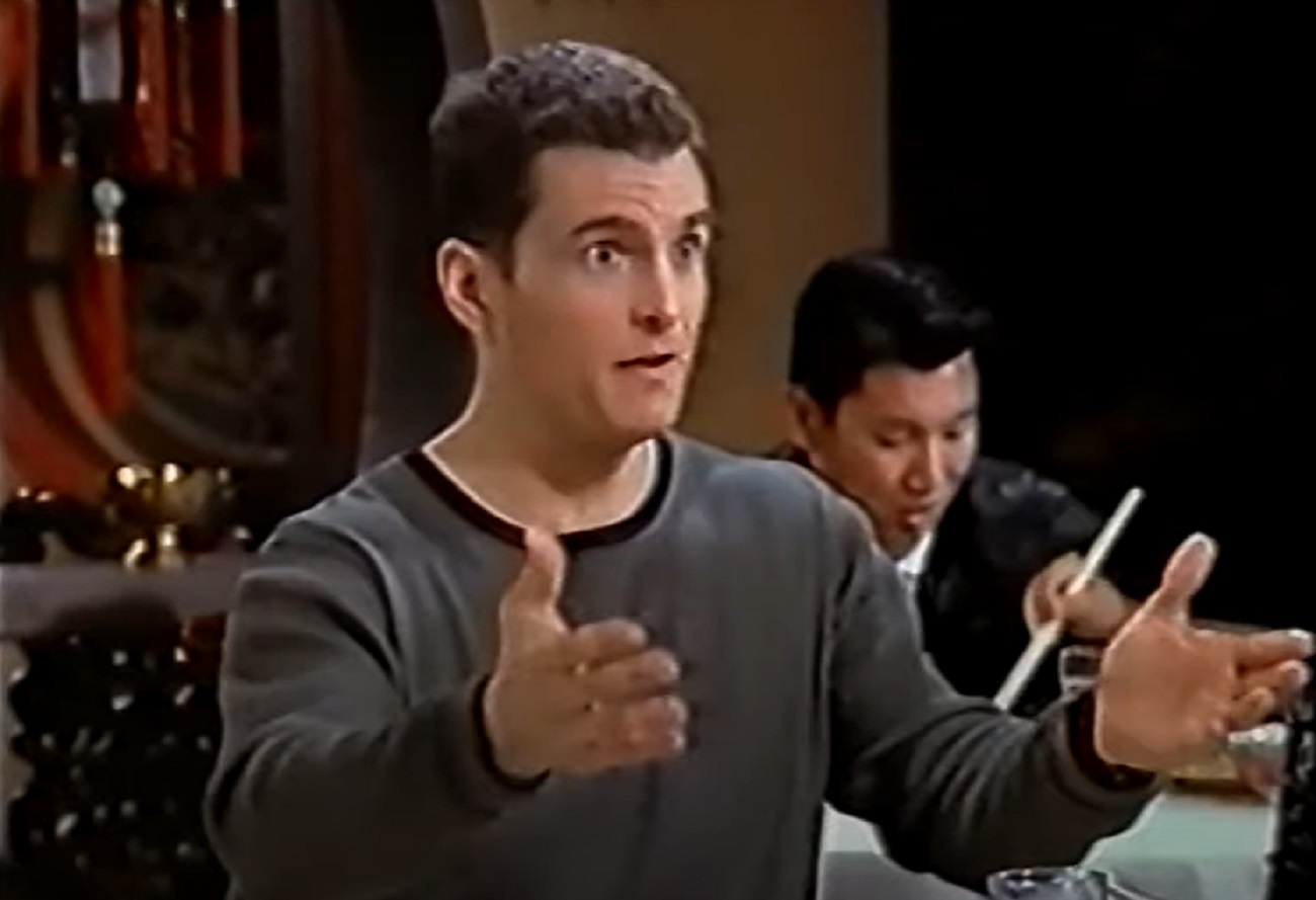Screenshot: David Strickland is talking and pointing with hands - from  Suddenly Susan (1996-2000)
