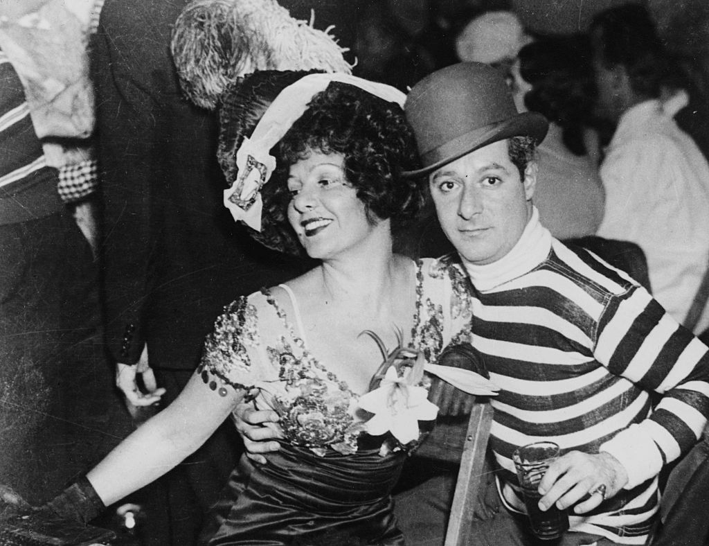 Actors and spouses George Jessel and Norma Talmadge at a party