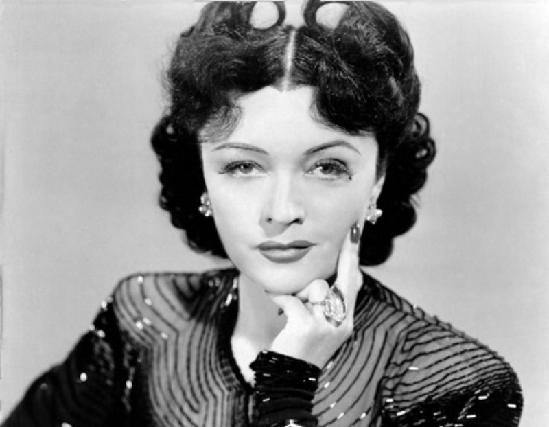 Pola Negri in a publicity portrait from Hi Diddle Diddle (1943) in black dress