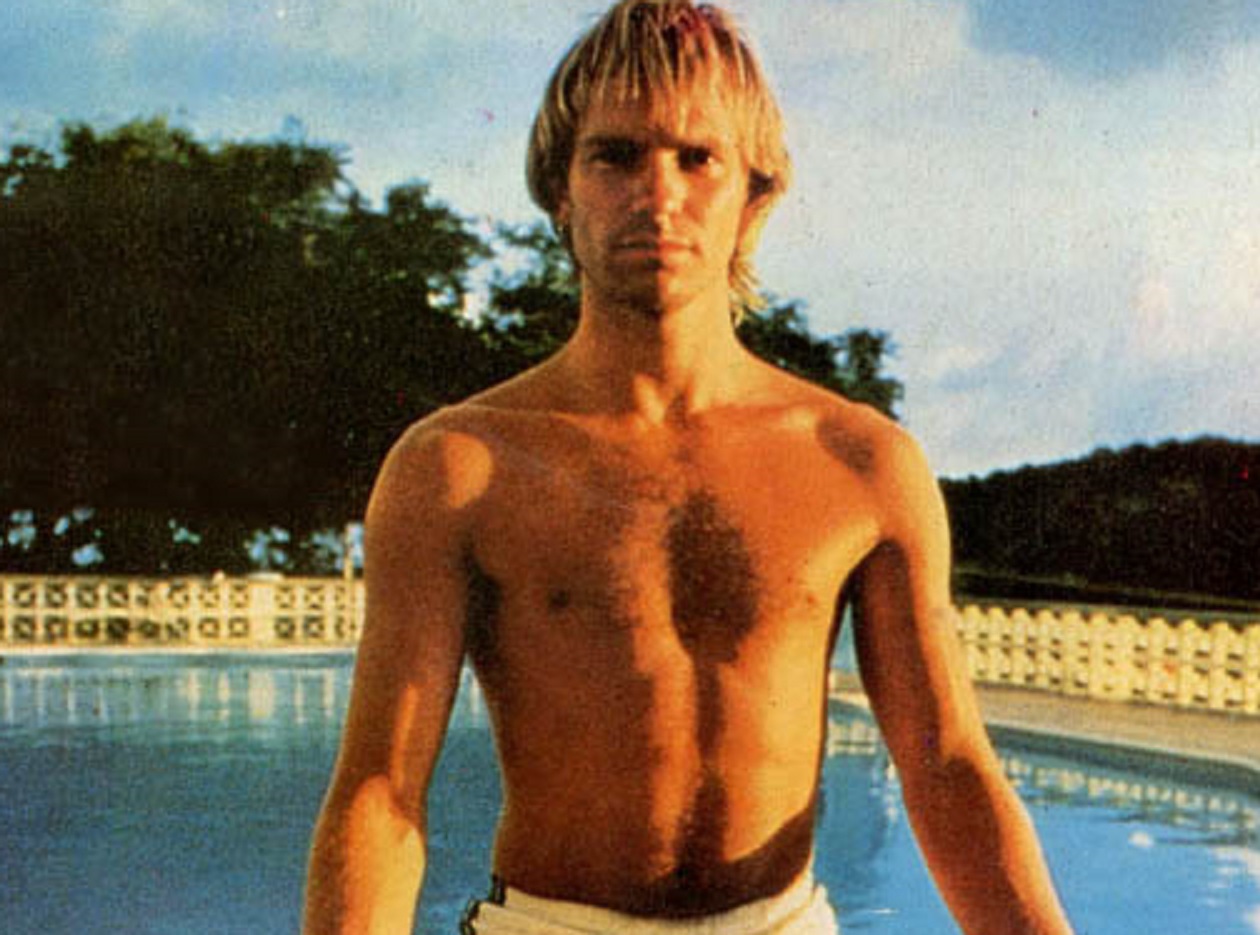 Sting seating by the swimming pool without shirt - 1983