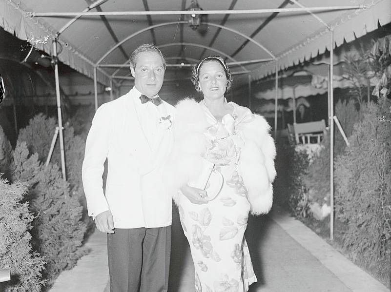 George Jessel and wife  Norma Talmadge  Walking From Hotel in formal clothes looking at the camera