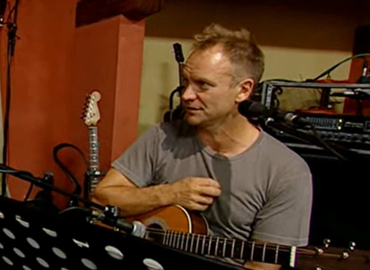 Screenshot: Sting holding a guitar at studio - from Sting-All This Time (2001)