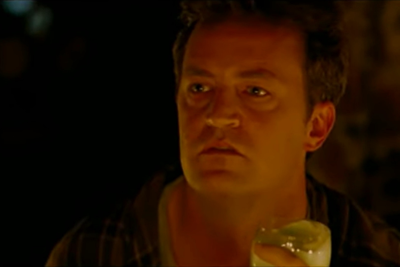 Screenshot: Matthew Perry is looking at side surprised in dark - from Birds Of America (2008)