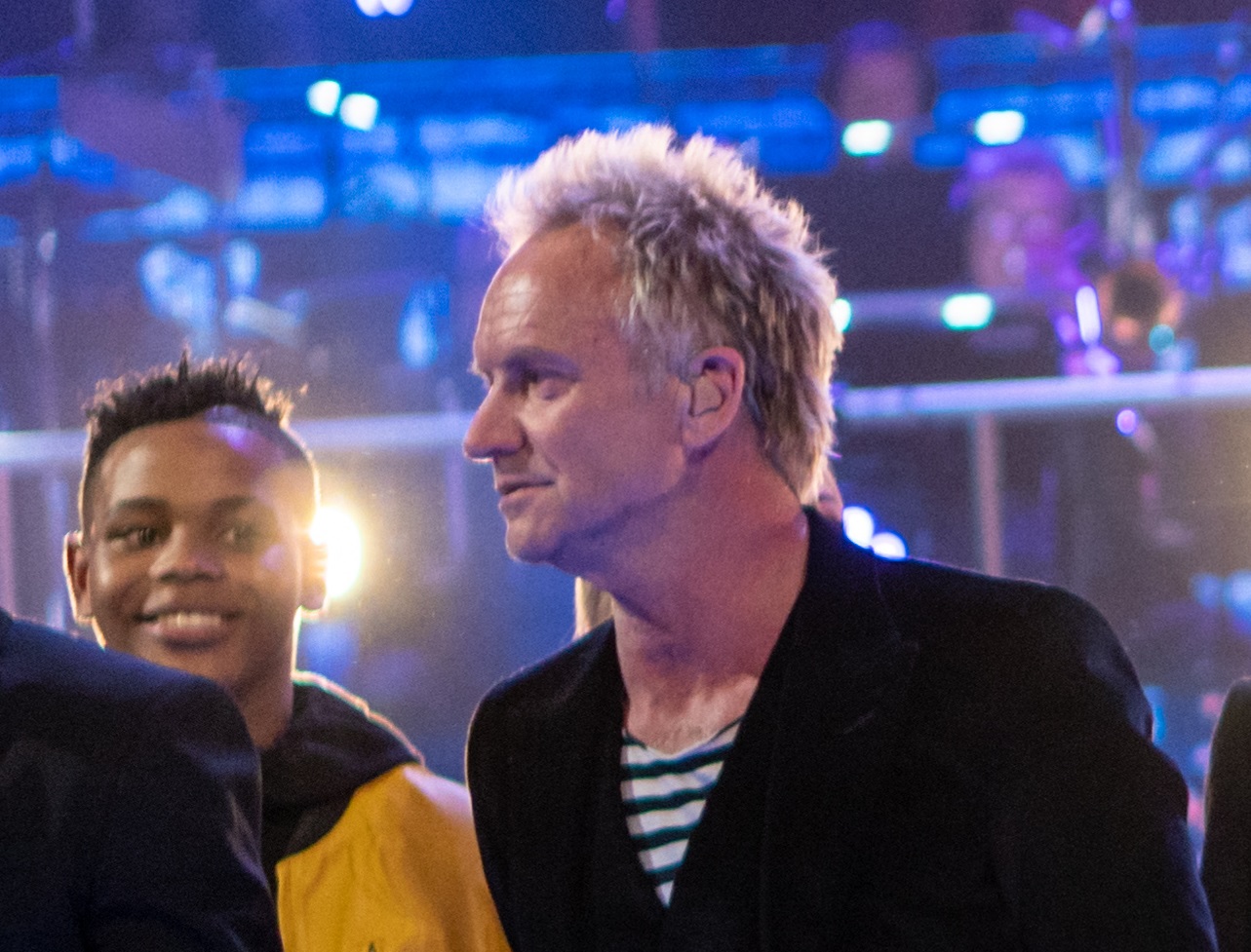 Sting is standing on stage and looking at side - 2018