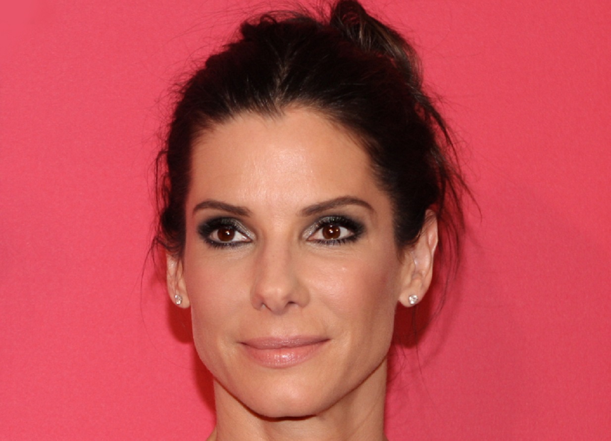 Portrait of Sandra Bullock looking at side and smiling - 2013